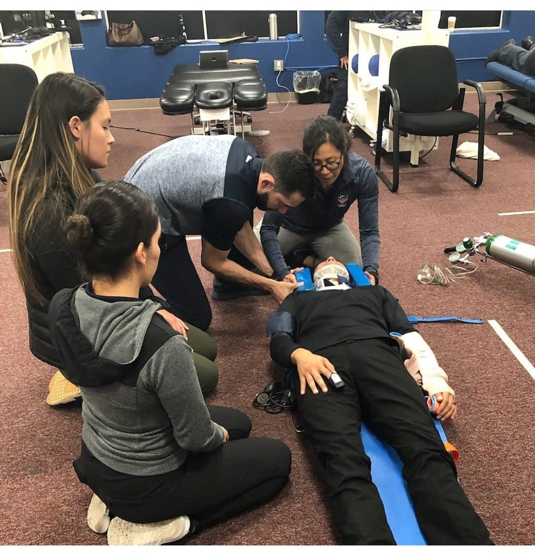 Emergency response and spinal management training with a care team