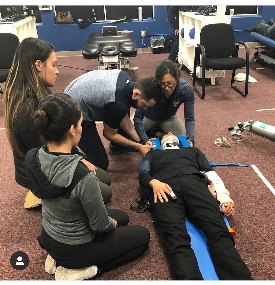 Emergency response and spinal management training with a care team